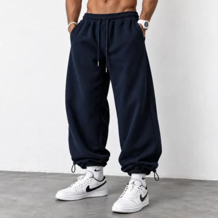 Baggy-style-joggers-3-thread-French-terry-cotton-Length-110-cm-Elastic-waistband-Adjustable-cuffs-with-toggles-Navy-blue-Code-8005-www.heroshoop.com-view-1.webp