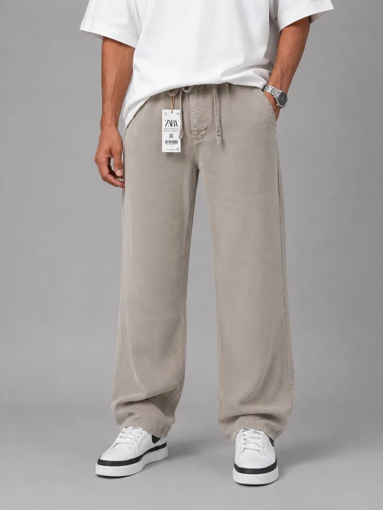 Men-baggy-style-fabric-pants-Khaki-lyocell-fabric-heroshoop.webp شلوار پارچه ای مردانه قواره بگ استایل / پارچه لیوسل / خاکی - تصویر 1