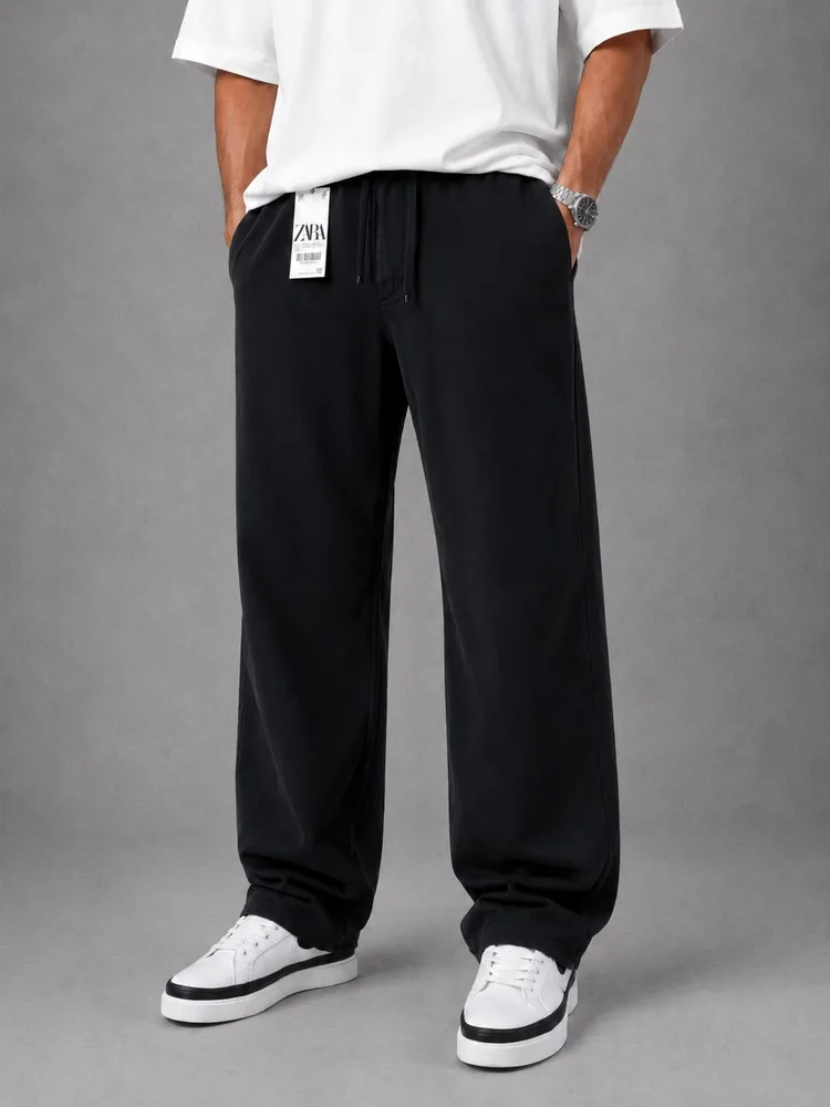 Men-baggy-style-fabric-pants-Lyocell-fabric-black-color-heroshoop.webp شلوار پارچه ای مردانه قواره بگ استایل / پارچه لیوسل / رنگ مشکی - تصویر 1