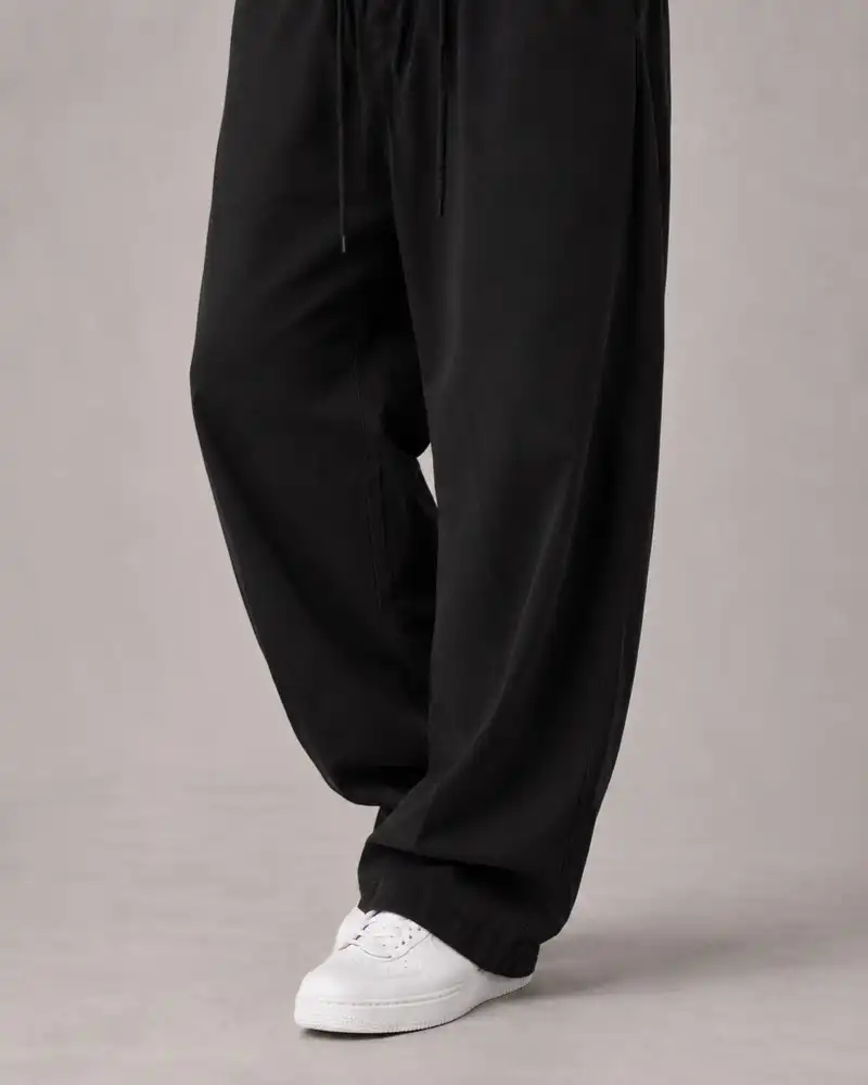 Natural-Lyocell-fabric-half-bag-pants-long-length-108-black-color-heroshoop-2.webp شلوار پارچه ای نیم بگ پارچه لایوسل طبیعی / قد بلند ۱۰۸ / رنگ مشکی ساده - تصویر 1