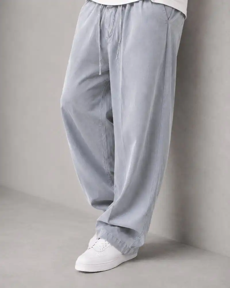 Natural-Lyocell-fabric-half-bag-pants-long-length-108-gray-color-heroshoop.webp شلوار پارچه ای نیم بگ پارچه لایوسل طبیعی / قد بلند ۱۰۸ / رنگ طوسی ساده - تصویر 1