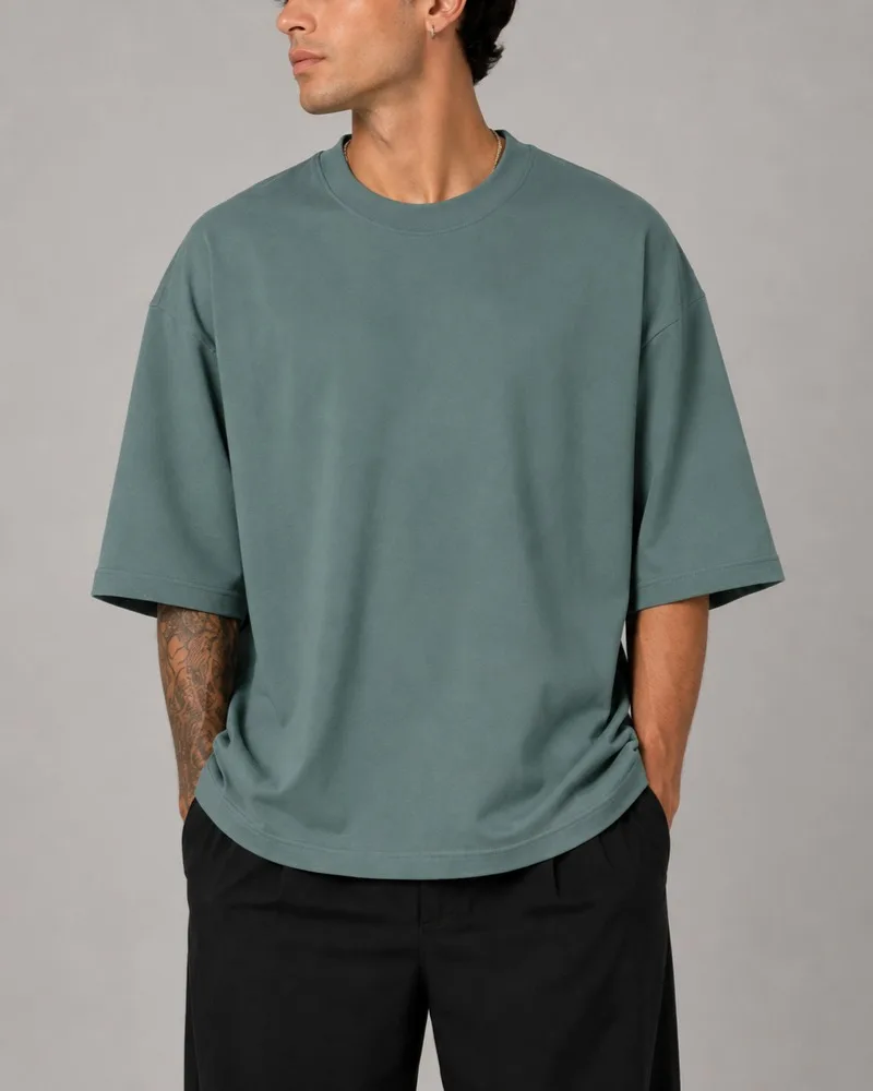 Simple-smoky-green-cotton-T-shirt-with-two-thread-design-Heroshoop.webp تیشرت ساده پنبه دو نخ / رنگ سبز دودی / کد 27137 - تصویر 1